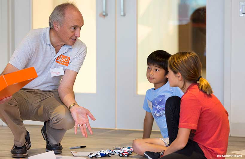 Andrew Gaule, ACMA, CGMA, chats with participants about what goes into running a Formula 1 race.