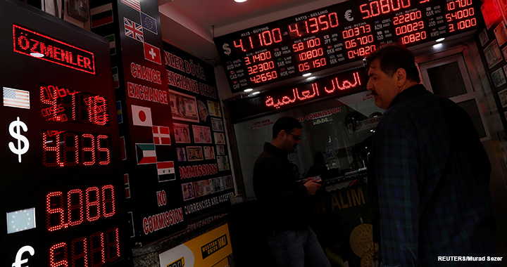 A man checks currency exchange rates at a currency exchange office in Istanbul, Turkey, 11 April 2018. REUTERS/Murad Sezer