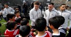 Members of the All Blacks, New Zealand’s national rugby team, sign autographs for young fans. Researcher Alex Hill attributes the club’s long-term success, in part, to making “some of the biggest changes to their team after a big win”.