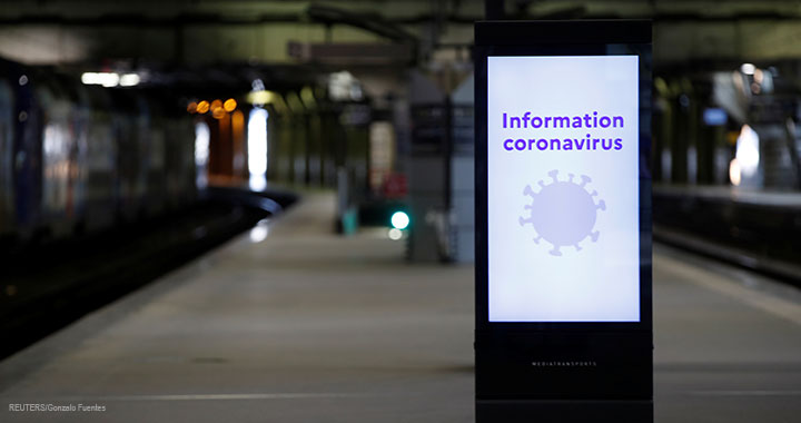 An information board about coronavirus is seen on a platform at Montparnasse train station in Paris, 13 March 2020.