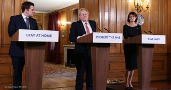 Prime Minister Boris Johnson, Secretary of State for Housing, Communities and Local Government Robert Jenrick, and Deputy Chief Medical Officer Dr. Jenny Harries attend a news conference on the ongoing situation with the coronavirus disease in London, 22 March 2020.