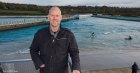 Craig Stoddart, ACMA, CGMA, standing above The Wave Bristol surf park in the UK, predicts the company will have ten surf parks operating worldwide within the next decade.