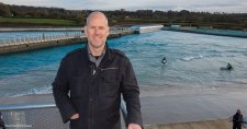 Craig Stoddart, ACMA, CGMA, standing above The Wave Bristol surf park in the UK, predicts the company will have ten surf parks operating worldwide within the next decade.