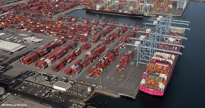 Shipping containers are unloaded from ships at a container terminal at the Port of Long Beach-Port of Los Angeles complex, amid the COVID-19 pandemic, in Los Angeles, California, 7 April 2021.