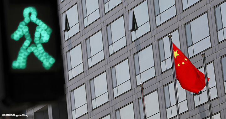 A Chinese national flag flutters outside the China Securities Regulatory Commission (CSRC) building on the Financial Street in Beijing, China, 9 July 2021.