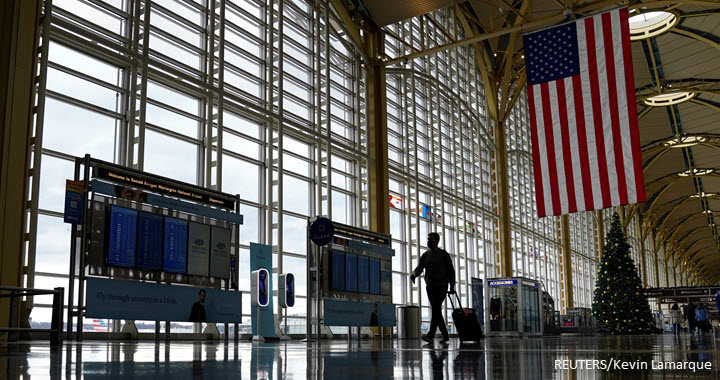 A traveller makes his way through the Ronald Reagan Washington National Airport, in Arlington, Virginia, US, 22 December 2020.