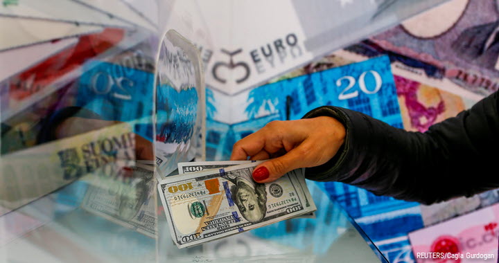 A money changer sells US dollar bills at a currency exchange office in Ankara, Turkey, 24 September 2021.