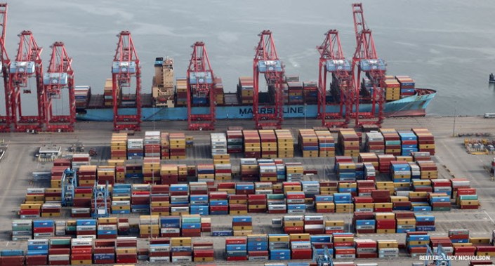 Shipping containers are unloaded from a ship at a container terminal at the Port of Long Beach-Port of Los Angeles complex, in Los Angeles, California, US.