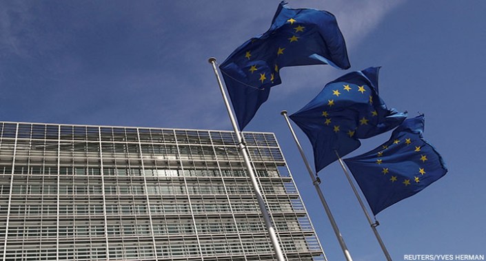 European Union flags flutter outside the European Commission headquarters in Brussels, Belgium, 24 March 2021.
