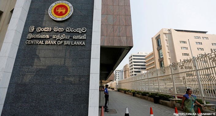A woman walks past the main entrance of the Sri Lanka's Central Bank in Colombo, Sri Lanka, 7 February 2017.
