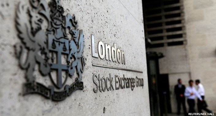 Pedestrians leave and enter the London Stock Exchange in London, UK, 15 August 2017.
