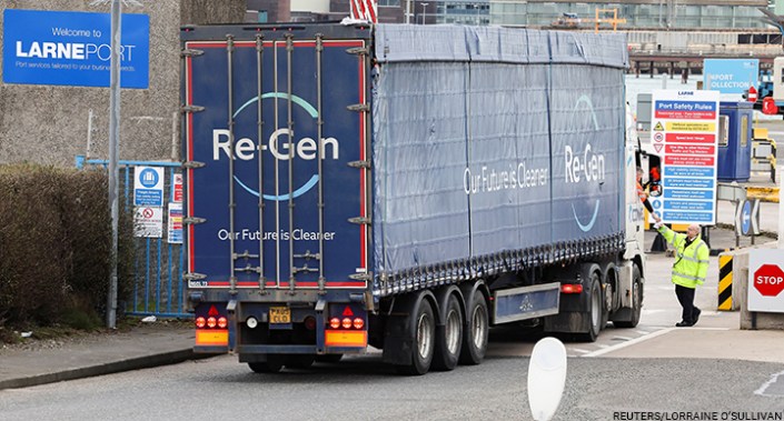 A truck driver shows documents to security before entering Larne Port, Northern Ireland, 27 February 2023.