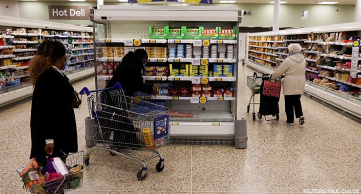 People shop inside a branch of a Tesco Extra supermarket in London, UK, on 10 February 2022.