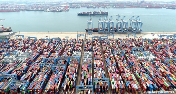 Containers and cargo vessels at the Qingdao port in Shandong province, China, 9 May 2022. Picture taken with a drone.