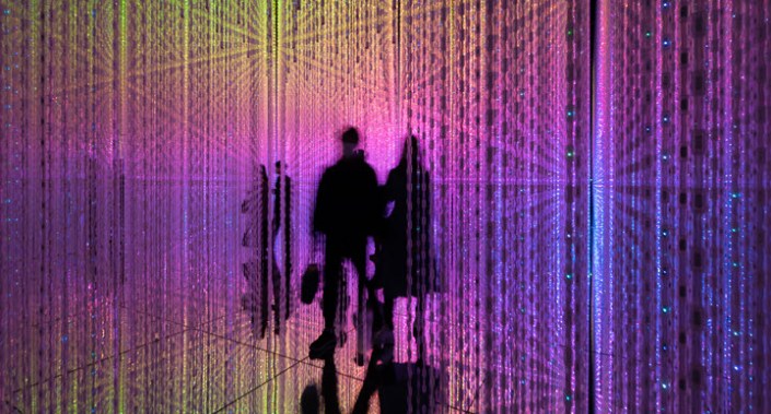 Silhouette of two people on digital background.